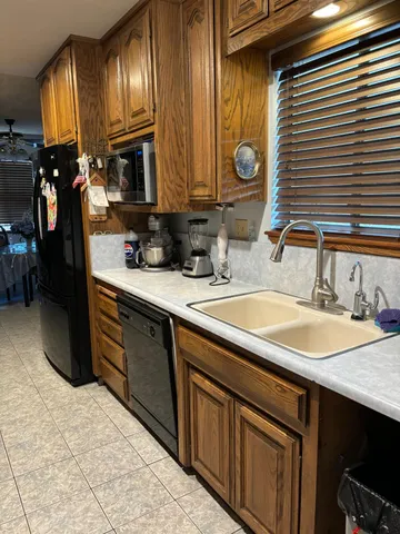 a bathroom with a sink double vanity and a mirror