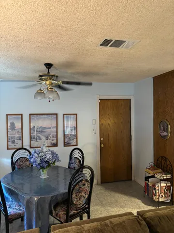a view of a dining room with furniture