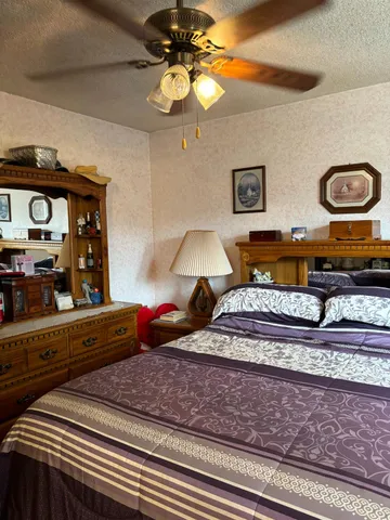 a bedroom with bed and window