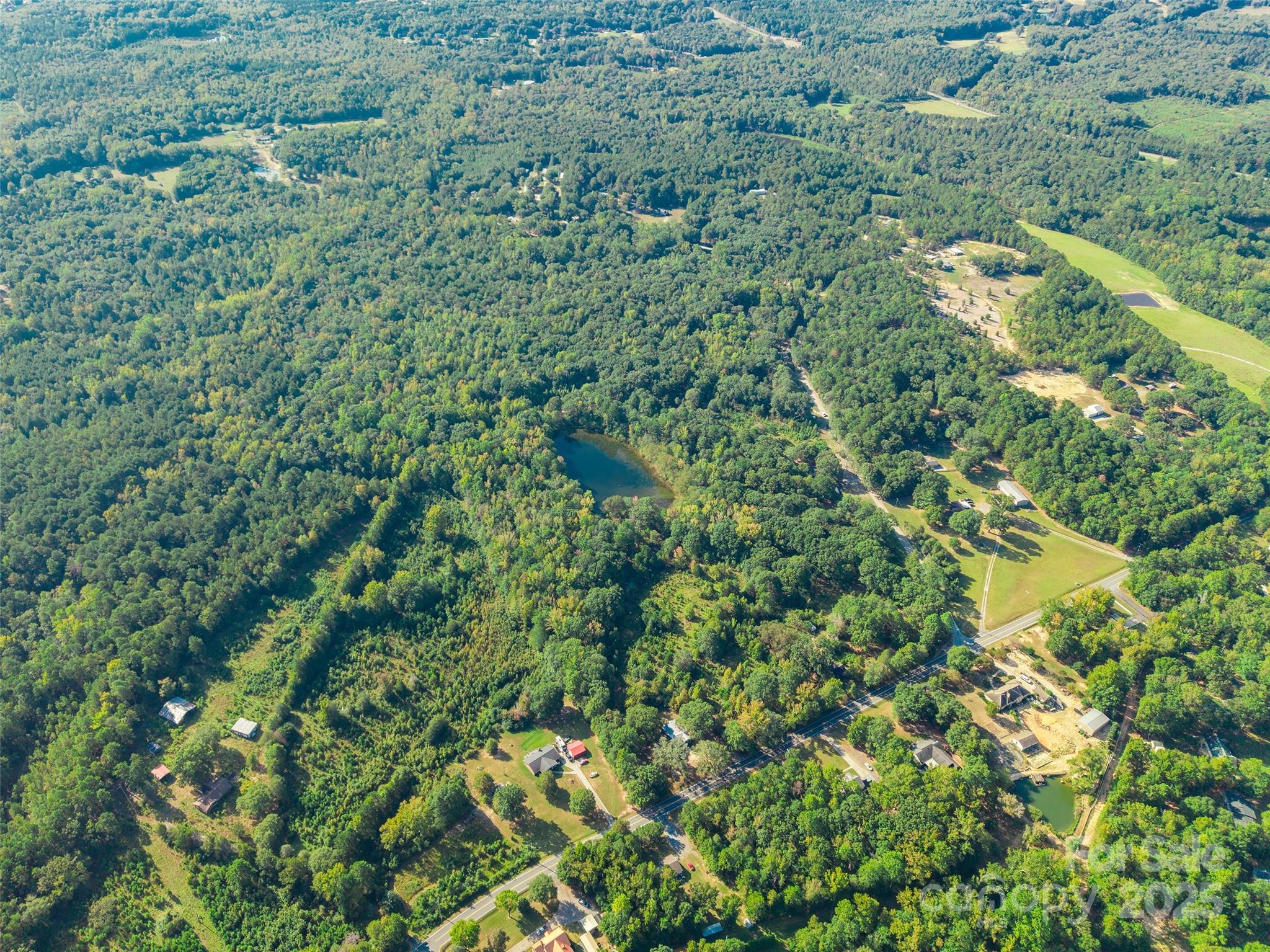 1652 Barringer Road Rock Hill, SC 29730 - Photo 10 of 13 a aerial view of a houses with a lush green forest