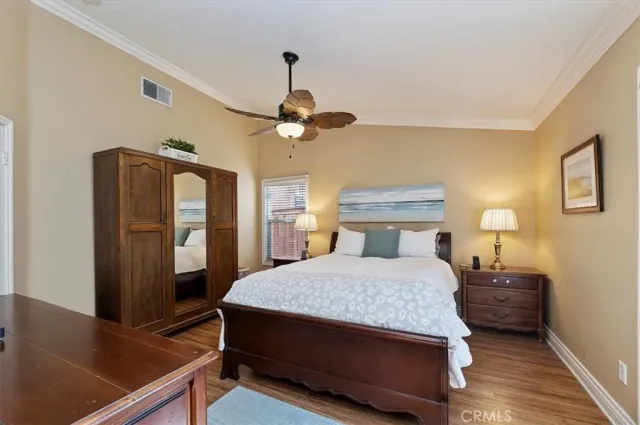 a bedroom with a bed window and a table