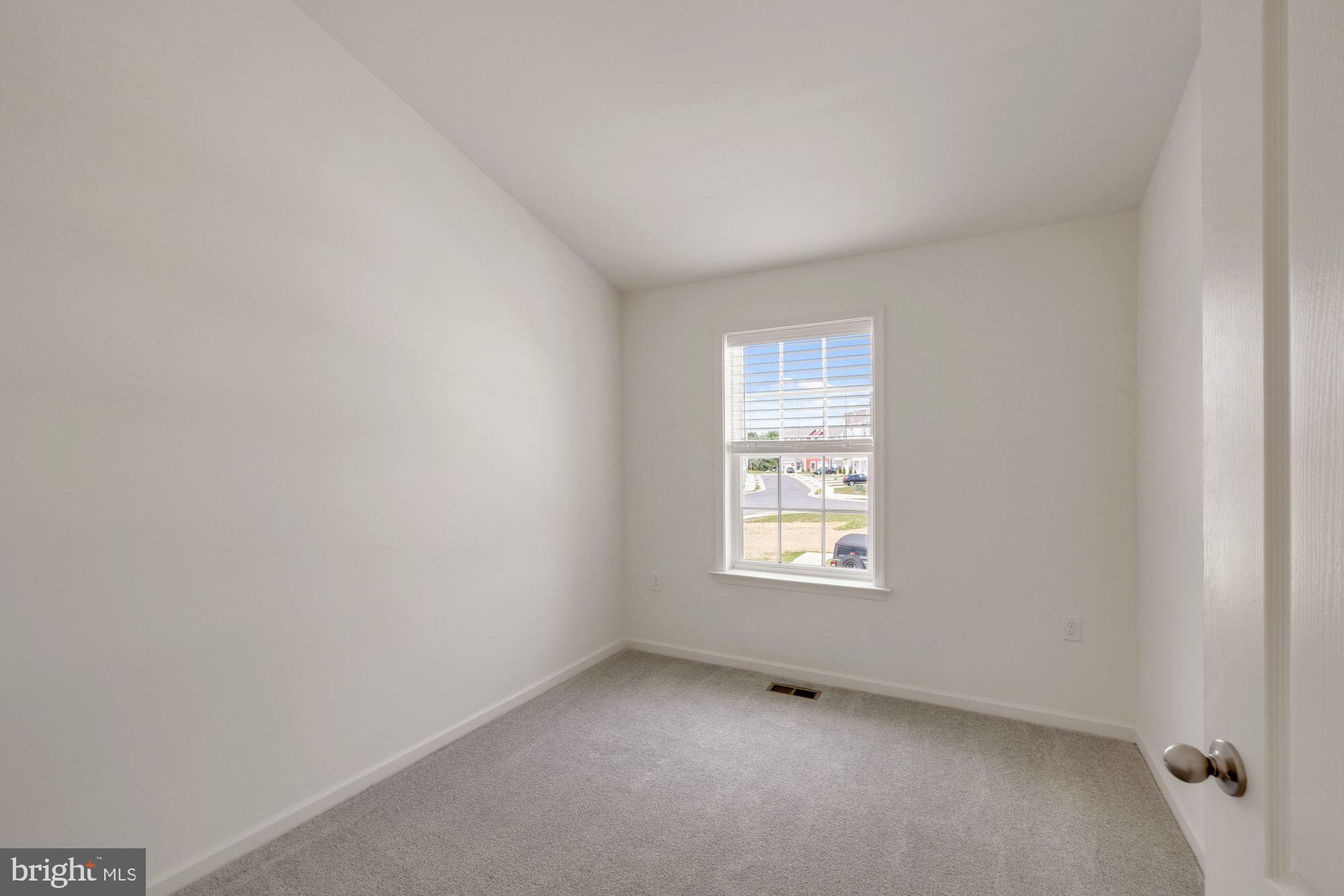 116 Copeley Circle Winchester, VA 22602 - Photo 18 of 23 a view of an empty room with a window