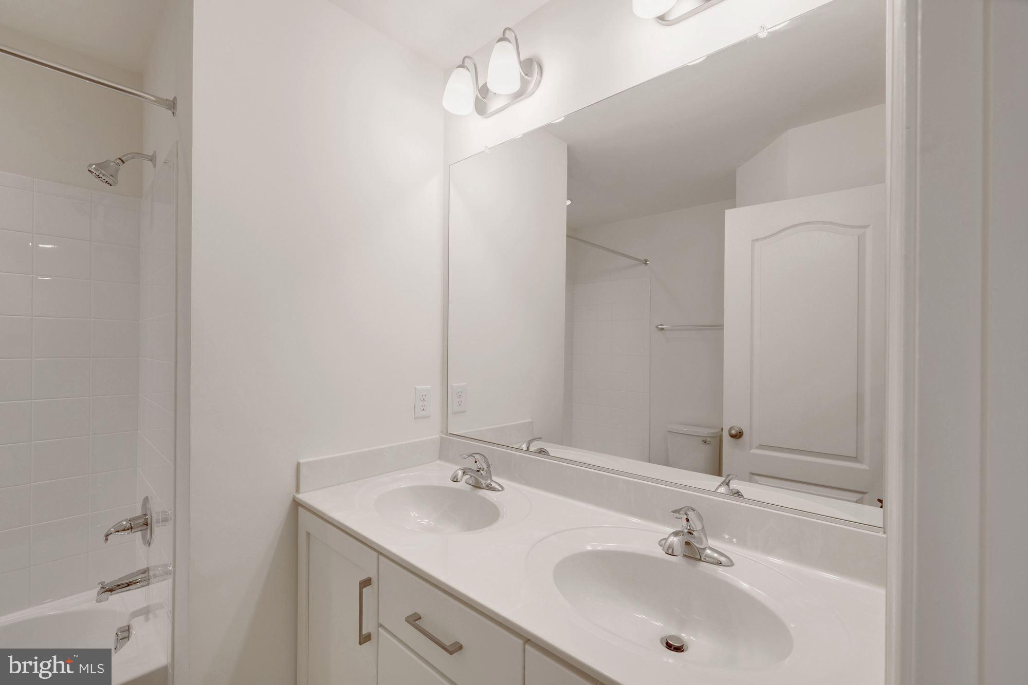 116 Copeley Circle Winchester, VA 22602 - Photo 20 of 23 a bathroom with a sink and a mirror