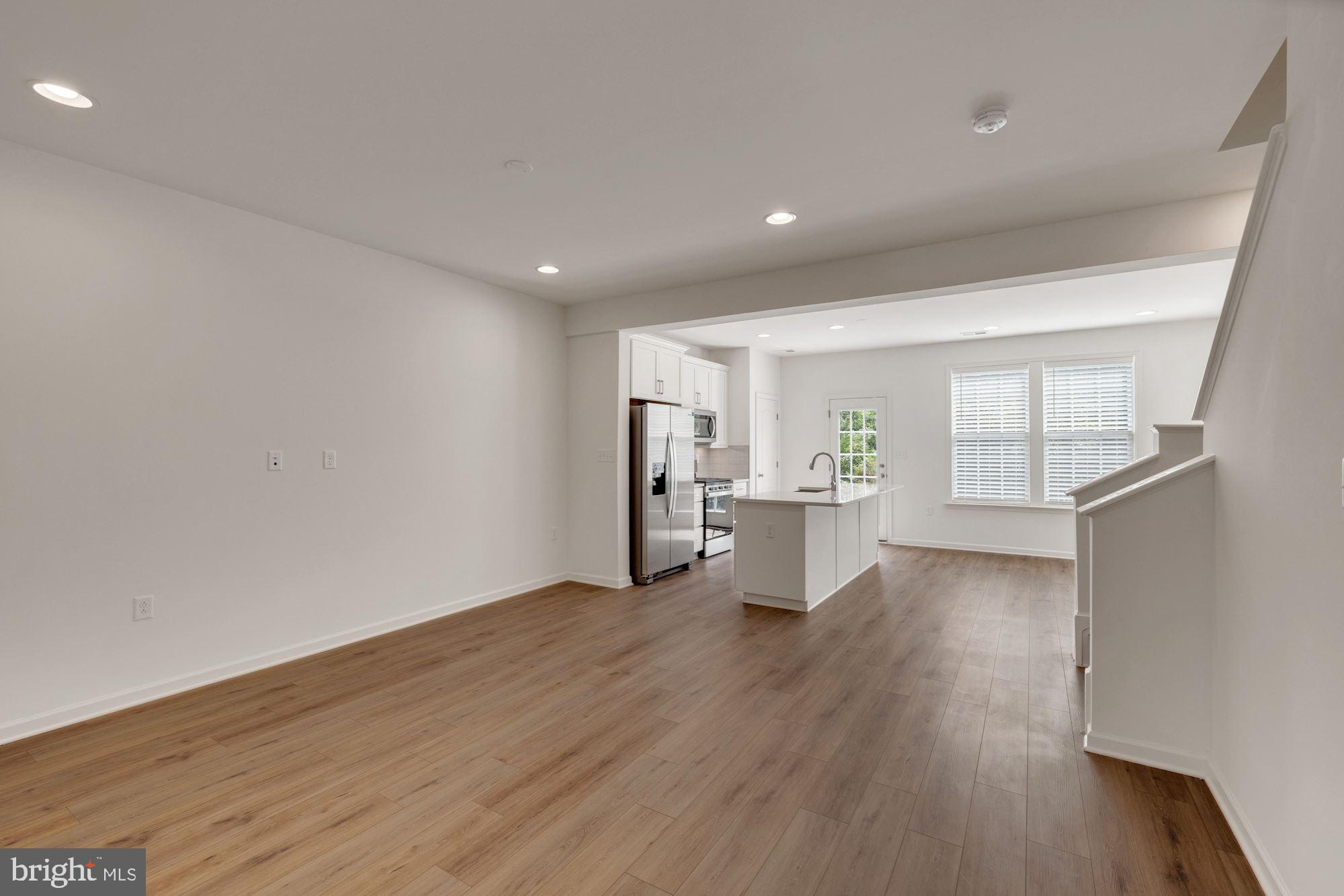 116 Copeley Circle Winchester, VA 22602 - Photo 4 of 23 a view of a big room with wooden floor and windows