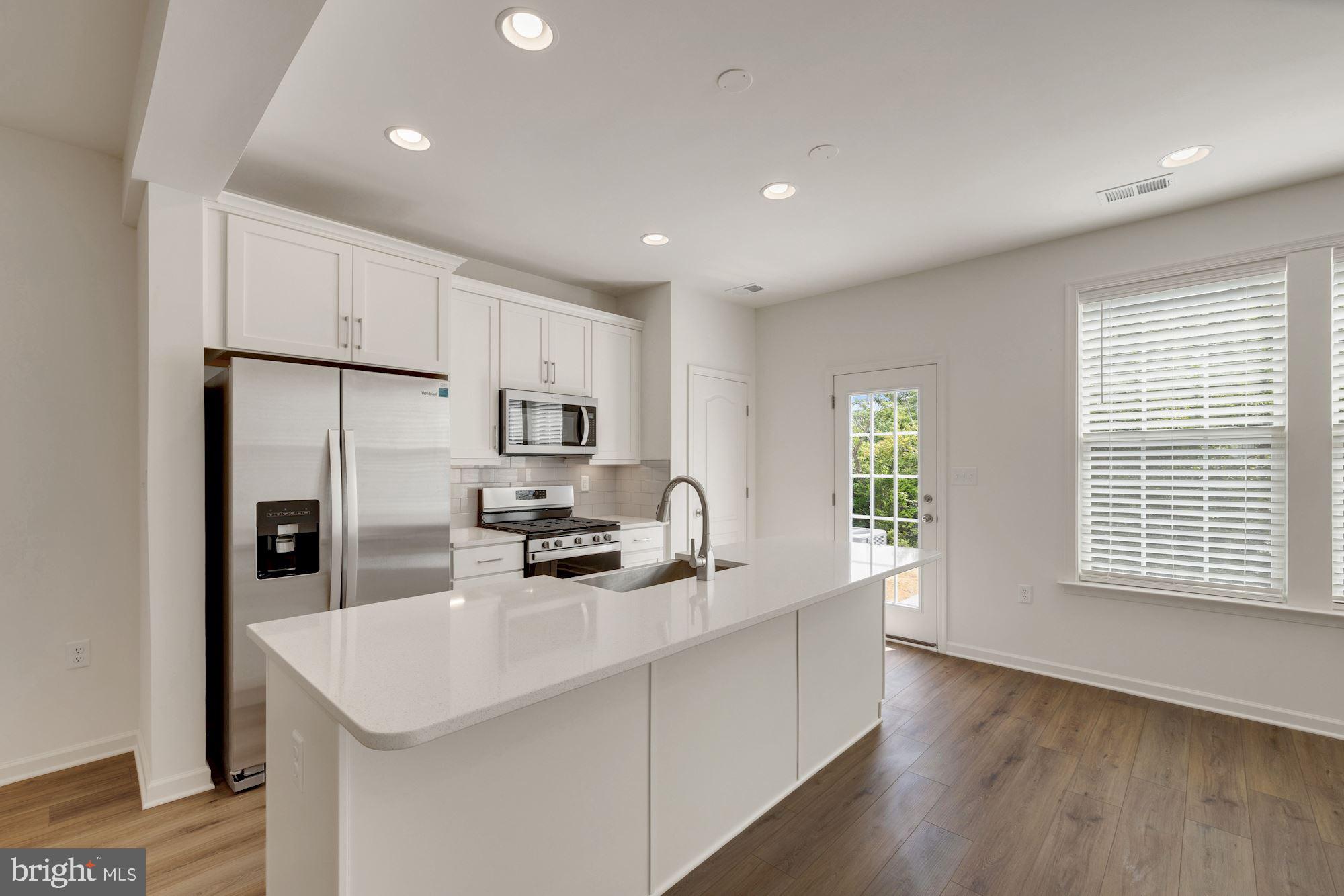 116 Copeley Circle Winchester, VA 22602 - Photo 5 of 23 a kitchen with counter top space cabinets and stainless steel appliances