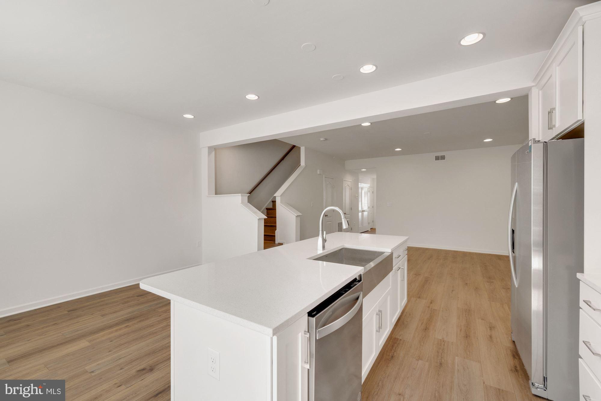 116 Copeley Circle Winchester, VA 22602 - Photo 7 of 23 a kitchen with a sink and wooden floor