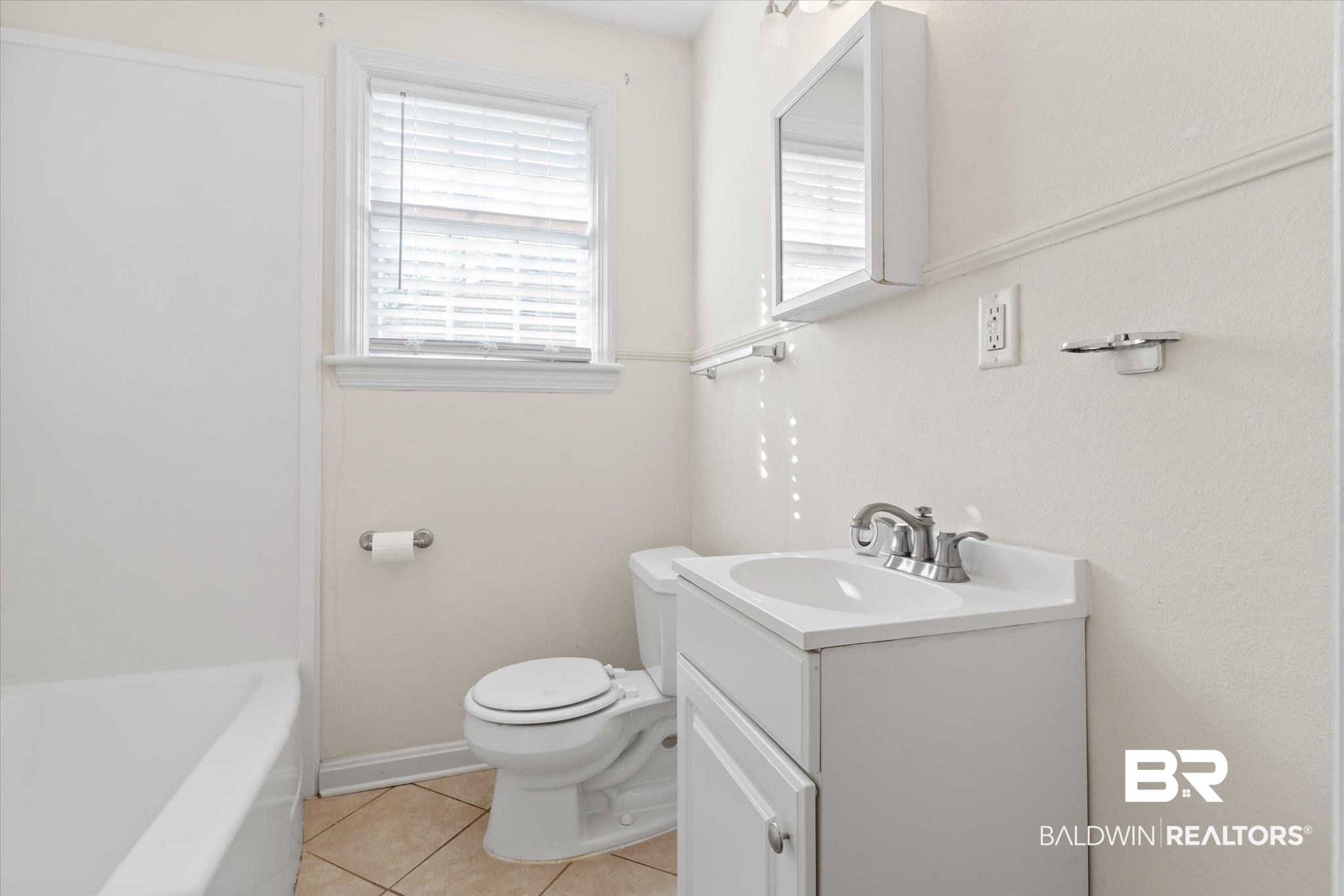 5113 Norton Lane Mobile, AL 36608 - Photo 13 of 20 Bathroom with tile patterned flooring, vanity, and toilet