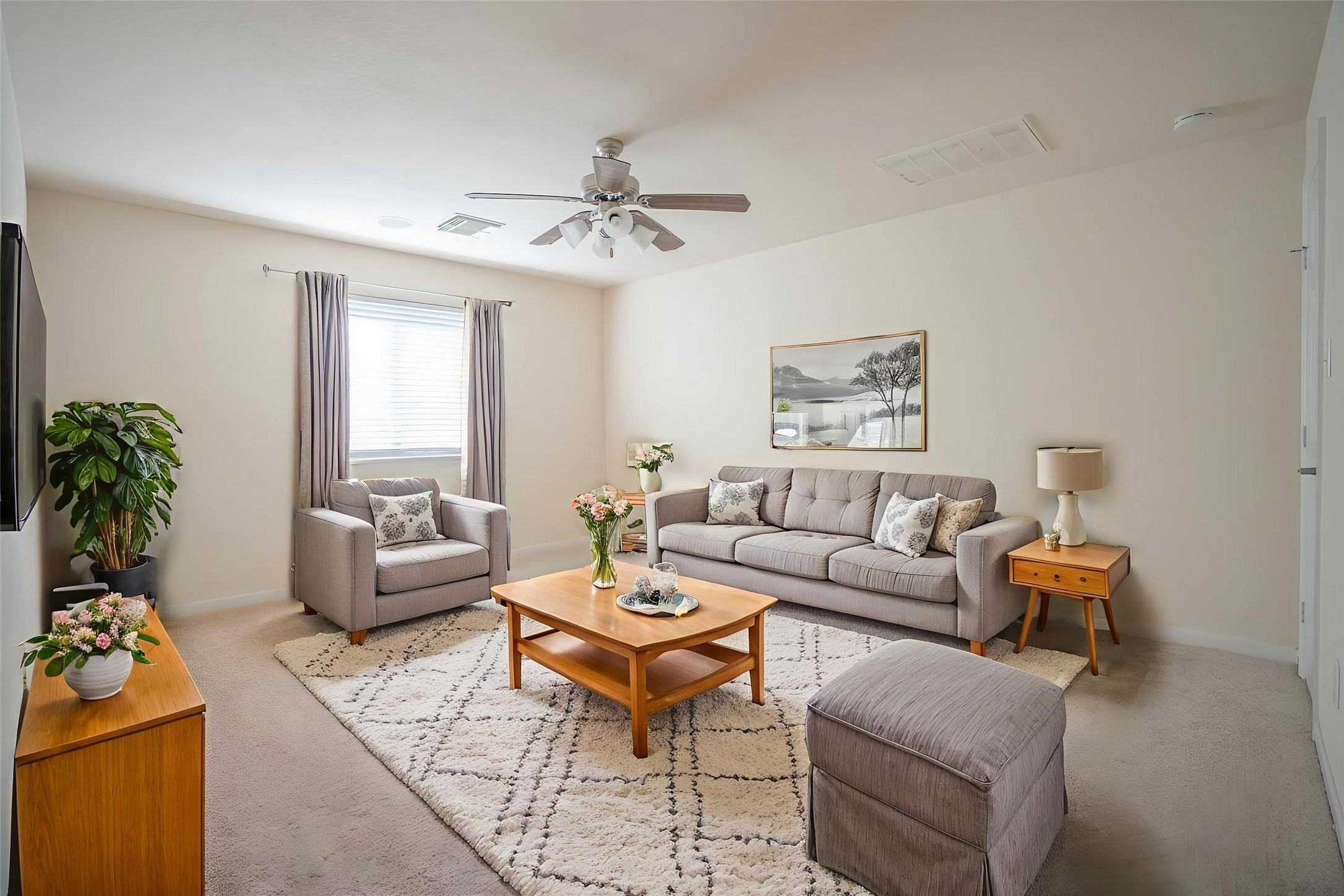 6403 Lost Timber Lane Houston, TX 77066 - Photo 23 of 34 a living room with furniture a chandelier and a window