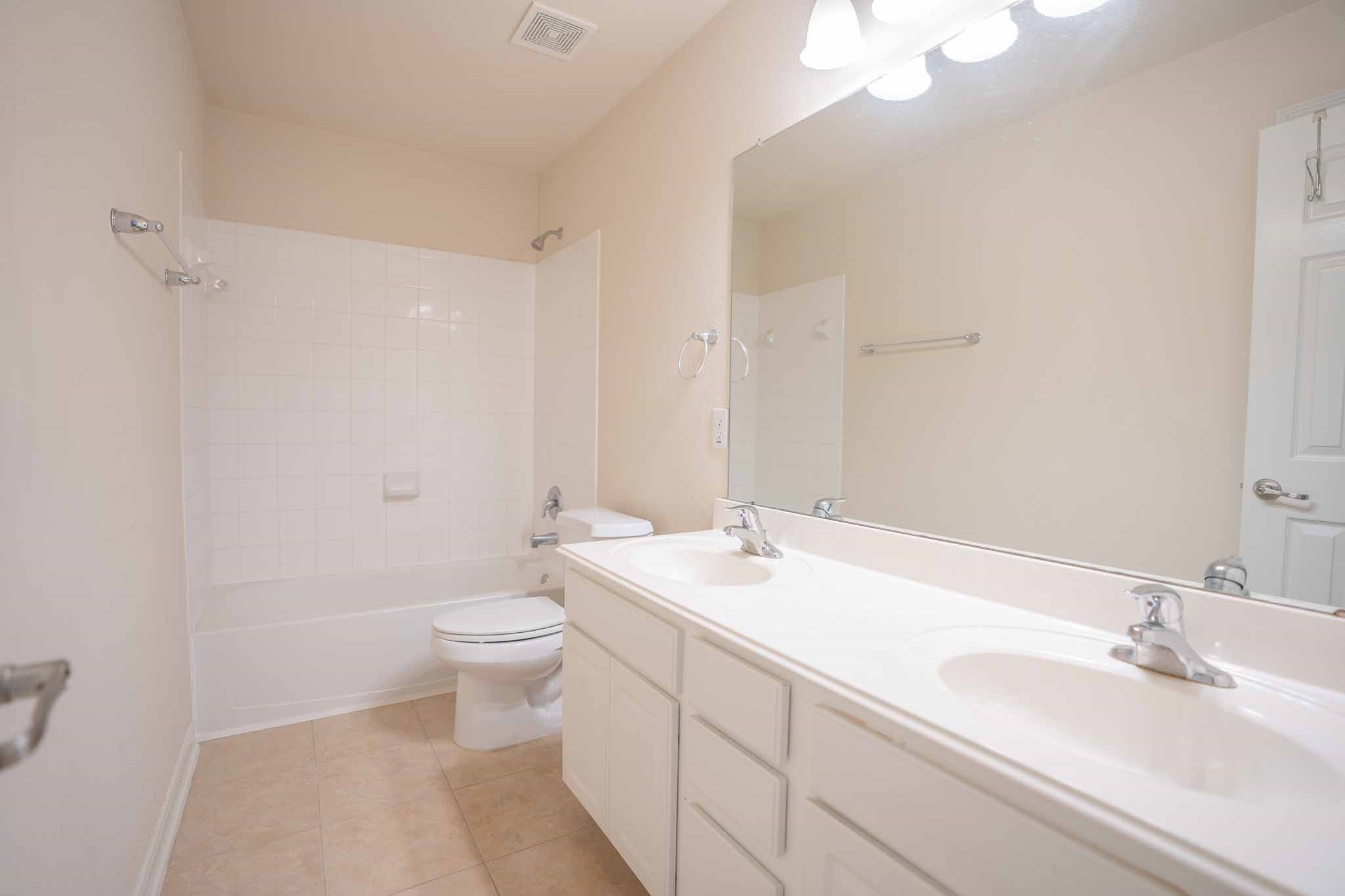 6403 Lost Timber Lane Houston, TX 77066 - Photo 27 of 34 a bathroom with a sink a toilet and a mirror