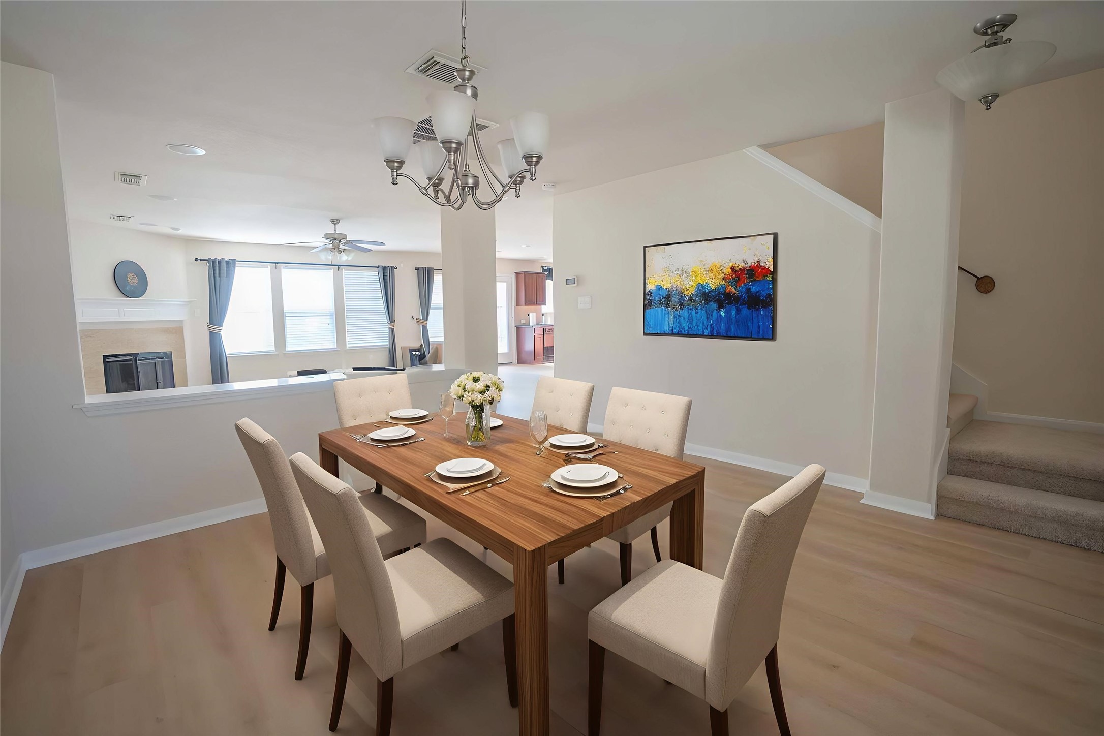 6403 Lost Timber Lane Houston, TX 77066 - Photo 6 of 34 a view of a dining room with furniture a chandelier and wooden floor