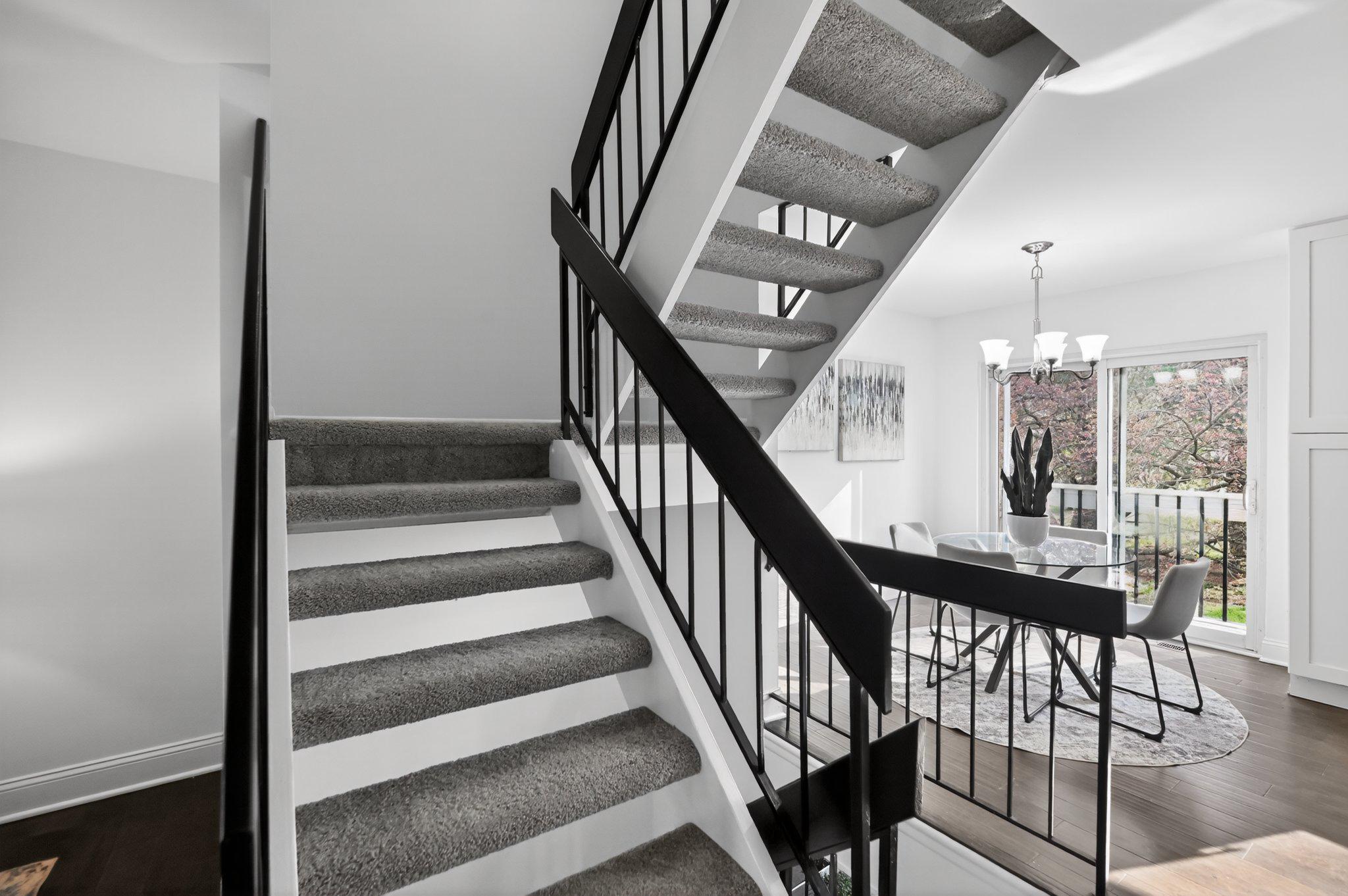 2434 Southgate Square Reston, VA 20191 - Photo 13 of 24 Modern staircase with natural light. Main lvl