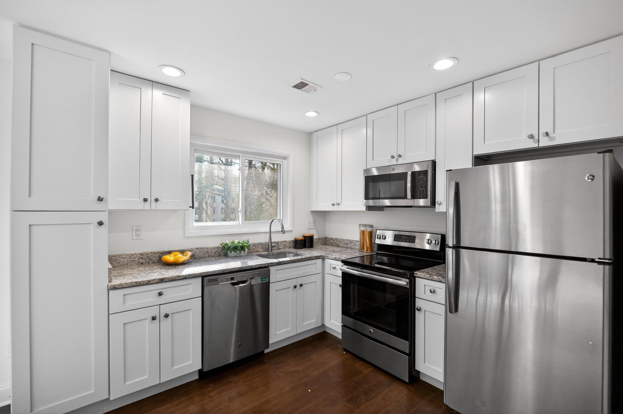 2434 Southgate Square Reston, VA 20191 - Photo 2 of 24 Modern kitchen with sleek finishes. Main lvl