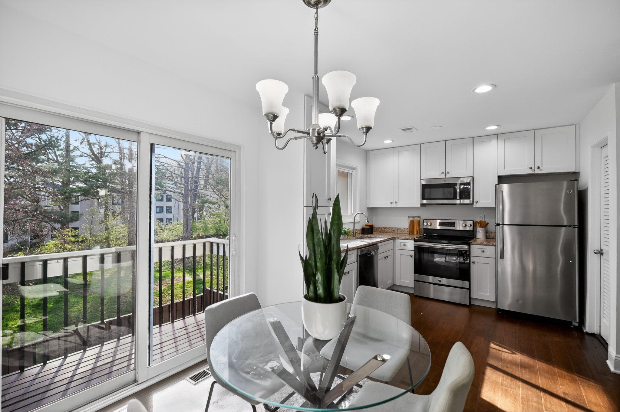 2434 Southgate Square Reston, VA 20191 - Photo 7 of 24 Bright kitchen-dinging combo with outdoor views.