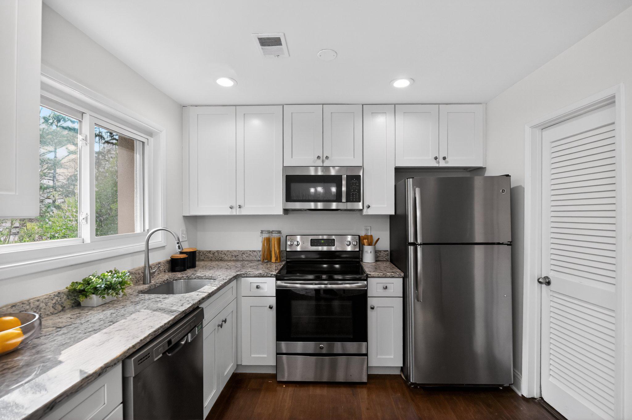 2434 Southgate Square Reston, VA 20191 - Photo 10 of 24 Modern kitchen with sleek finishes. Main lvl