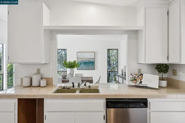 a kitchen with a sink and cabinets