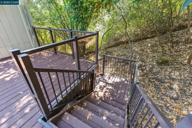 a view of staircase with a small deck
