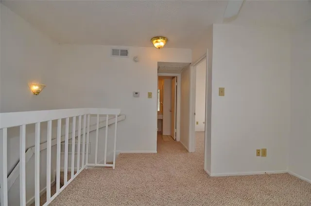 a bathroom with a toilet and shower