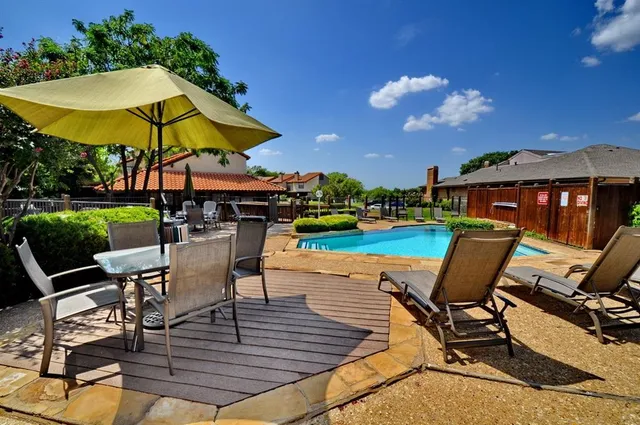 a living room with furniture fireplace and flat screen tv