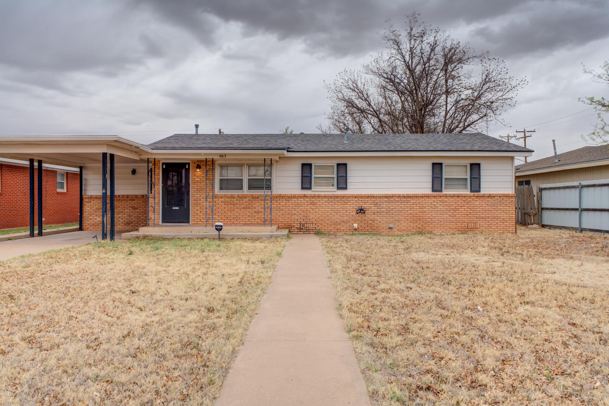 front view of a house with a yard