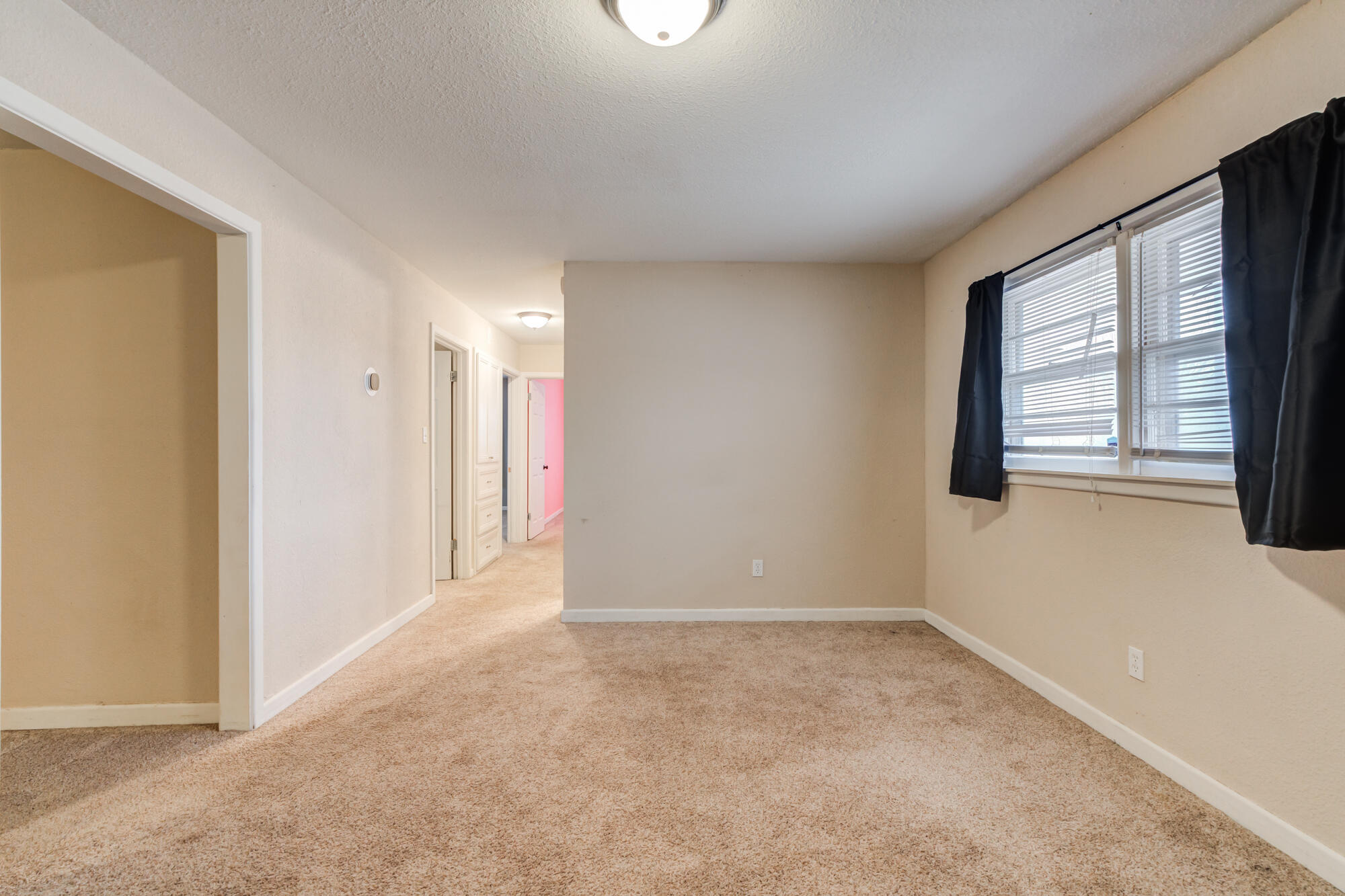403 East 19th Street Littlefield, TX 79339 - Photo 2 of 34 a view of an empty room with a window