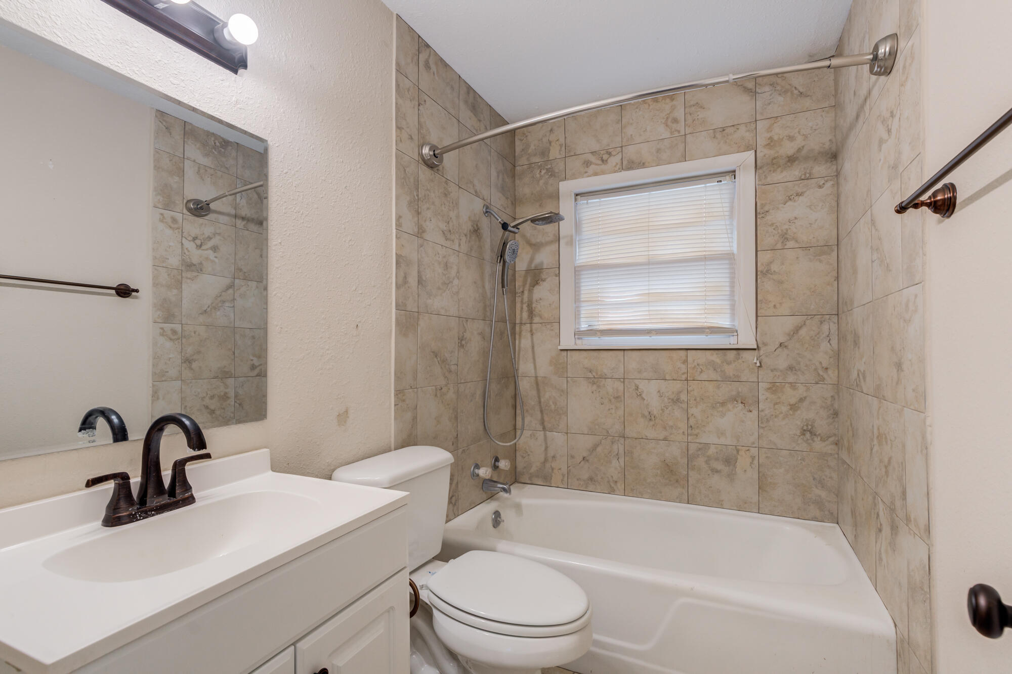 403 East 19th Street Littlefield, TX 79339 - Photo 30 of 34 a bathroom with a sink toilet and shower