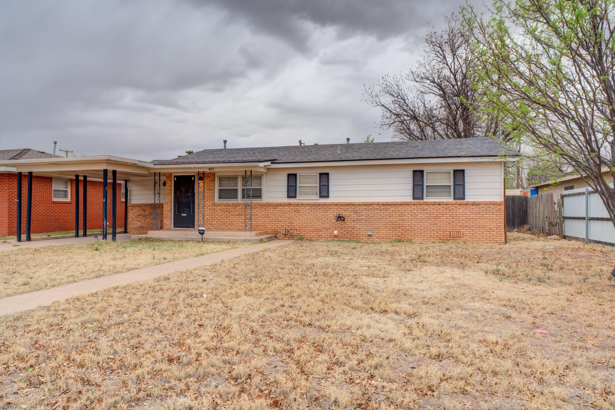 403 East 19th Street Littlefield, TX 79339 - Photo 6 of 34 front view of a house with a yard