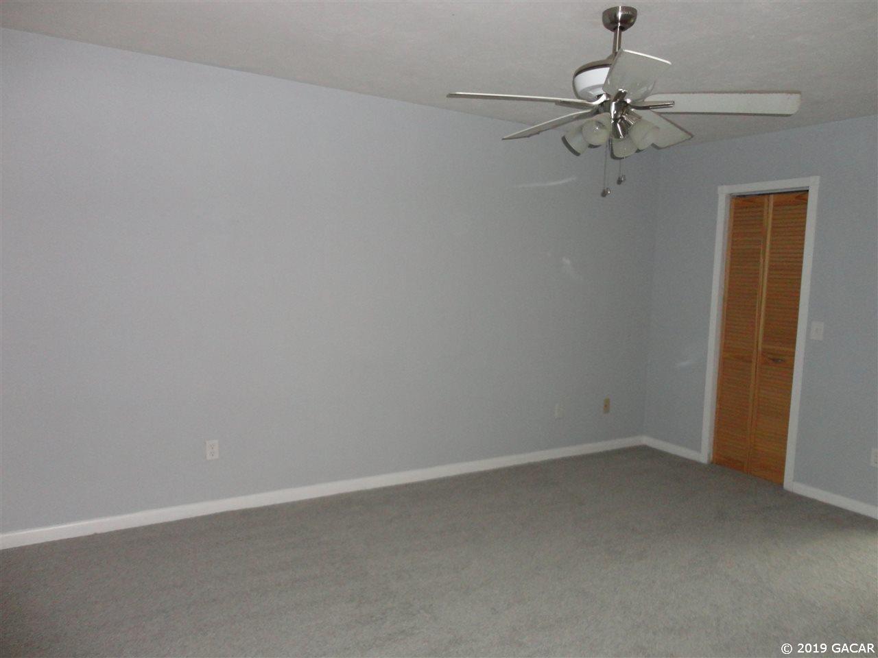 5518 Southwest 4th Place Gainesville, FL 32607 - Photo 8 of 9 door to walk-in closet