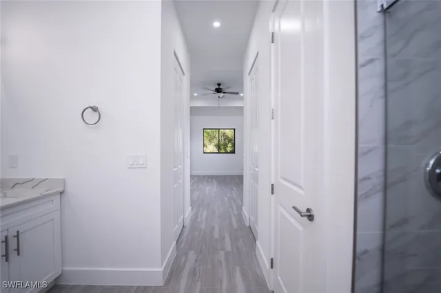 a view of kitchen with sink and wooden floor