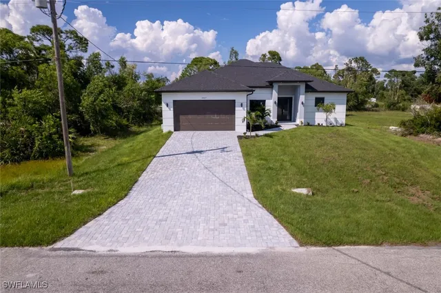 front view of a house with a yard