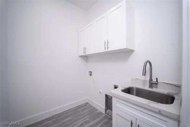 a bathroom with a granite countertop sink mirror and double