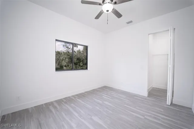 a view of kitchen with stainless steel appliances refrigerator oven and cabinets