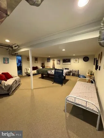 a living room with furniture gym equipment and a view of living room