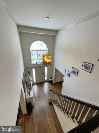 a view of a livingroom with furniture and a window