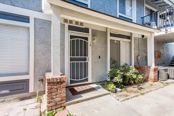 a kitchen that has a sink a stove and a wooden floors