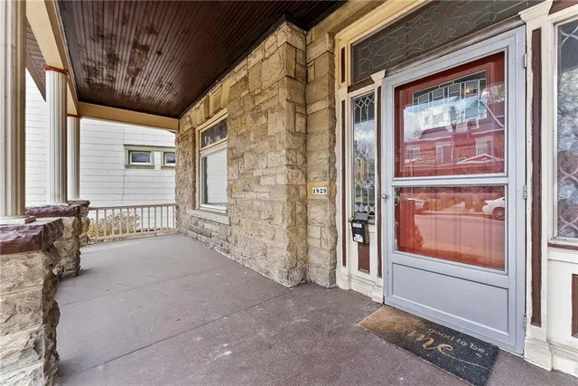a view of front door with a couch