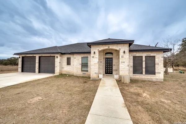 front view of a house with a yard
