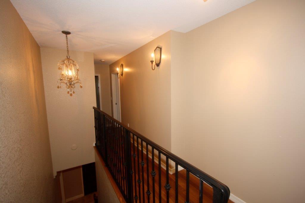 129 Walton Way Miramar Beach, FL 32550 - Photo 17 of 29 a view of a hallway with windows