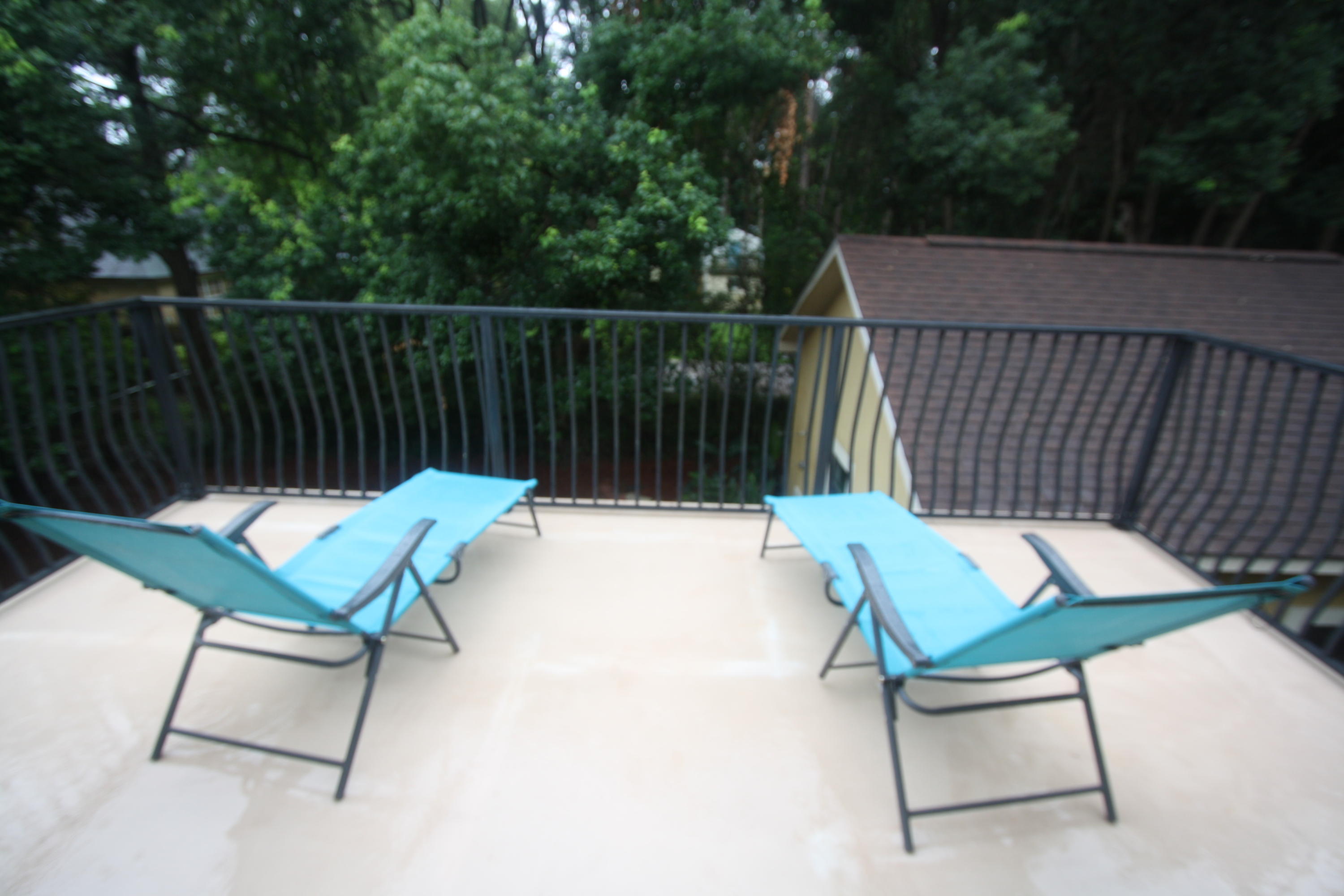 129 Walton Way Miramar Beach, FL 32550 - Photo 20 of 29 a view of a chairs and table in the back yard of the house