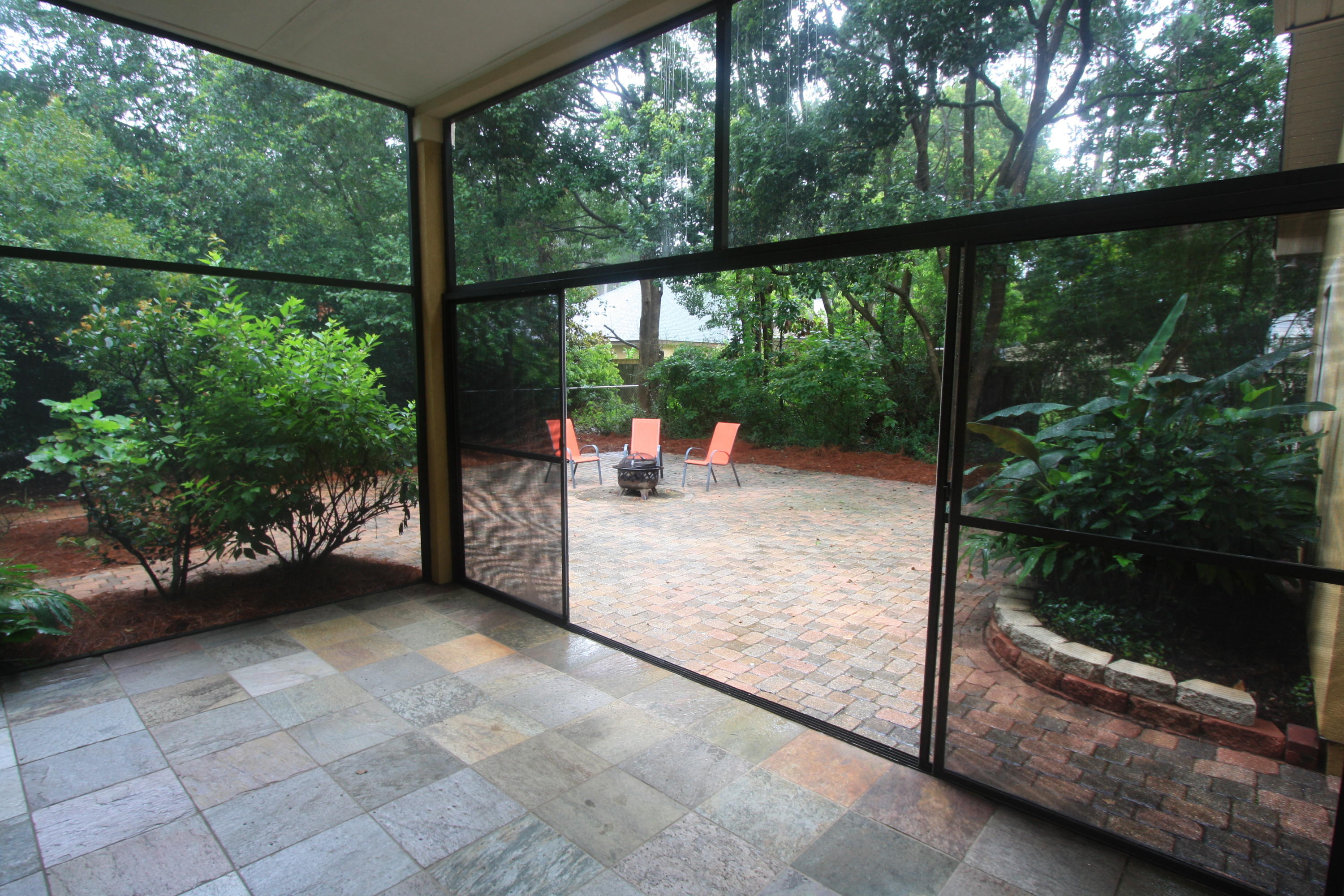 129 Walton Way Miramar Beach, FL 32550 - Photo 22 of 29 a view of a porch with furniture and garden
