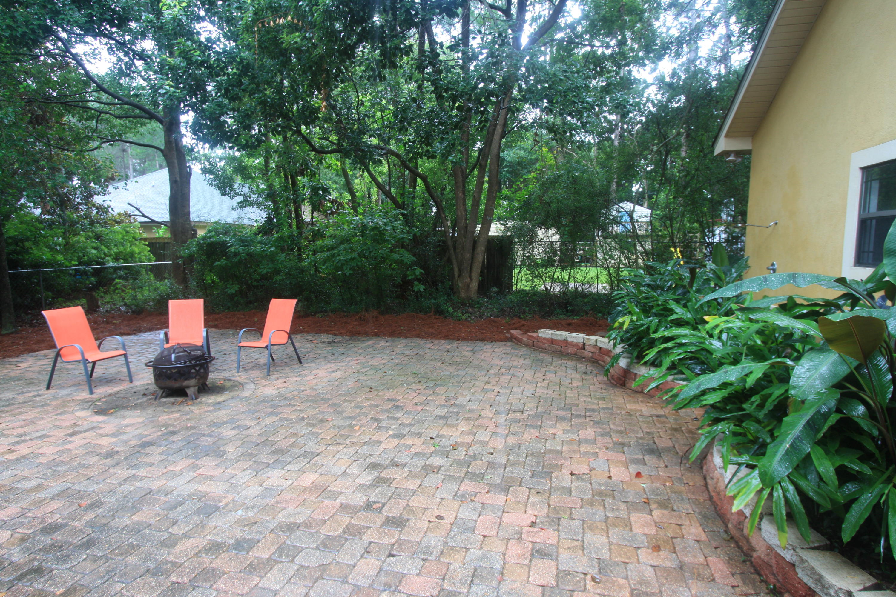 129 Walton Way Miramar Beach, FL 32550 - Photo 23 of 29 a backyard of a house with seating space