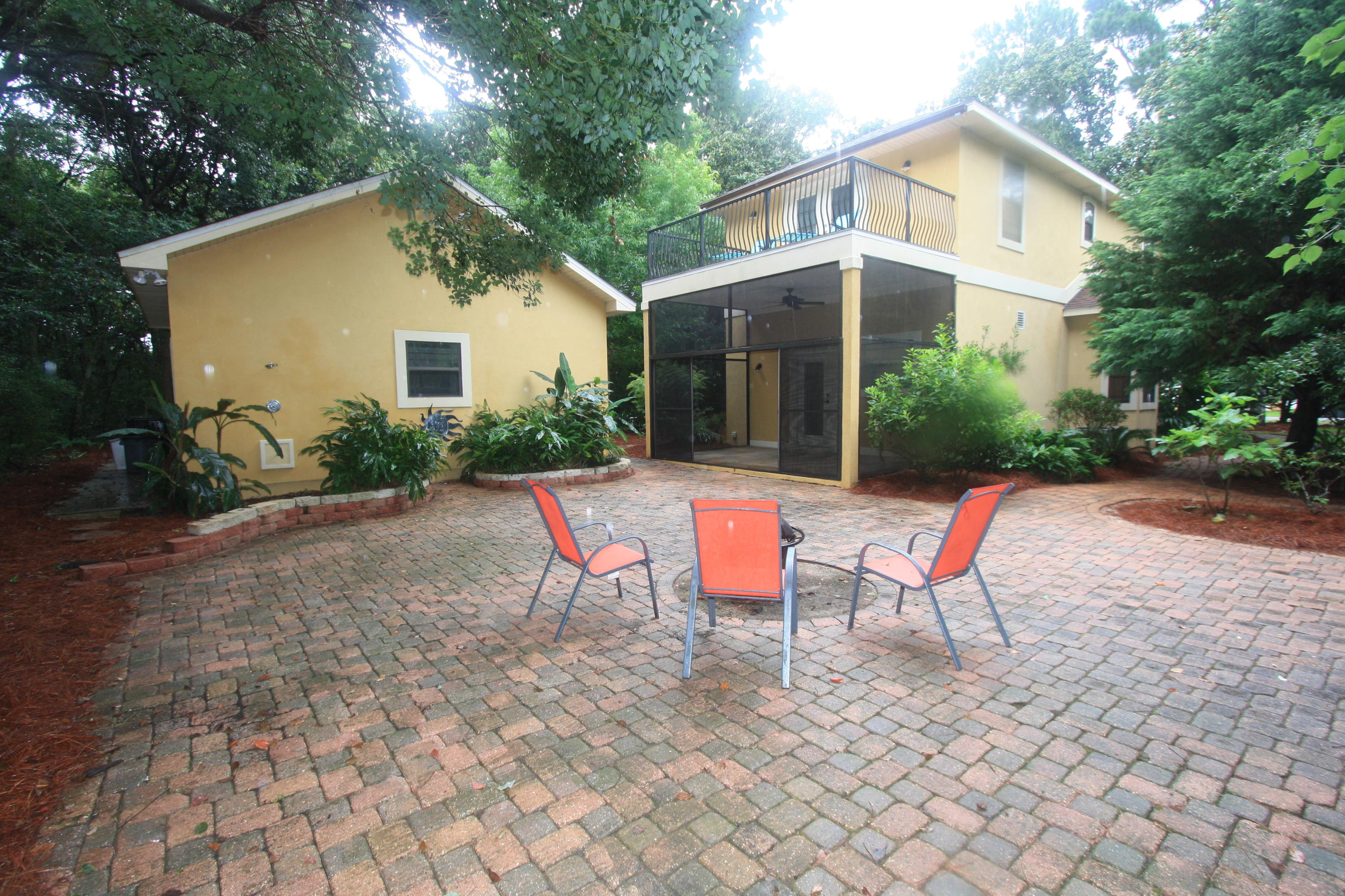 129 Walton Way Miramar Beach, FL 32550 - Photo 25 of 29 a view of a house with backyard and sitting area
