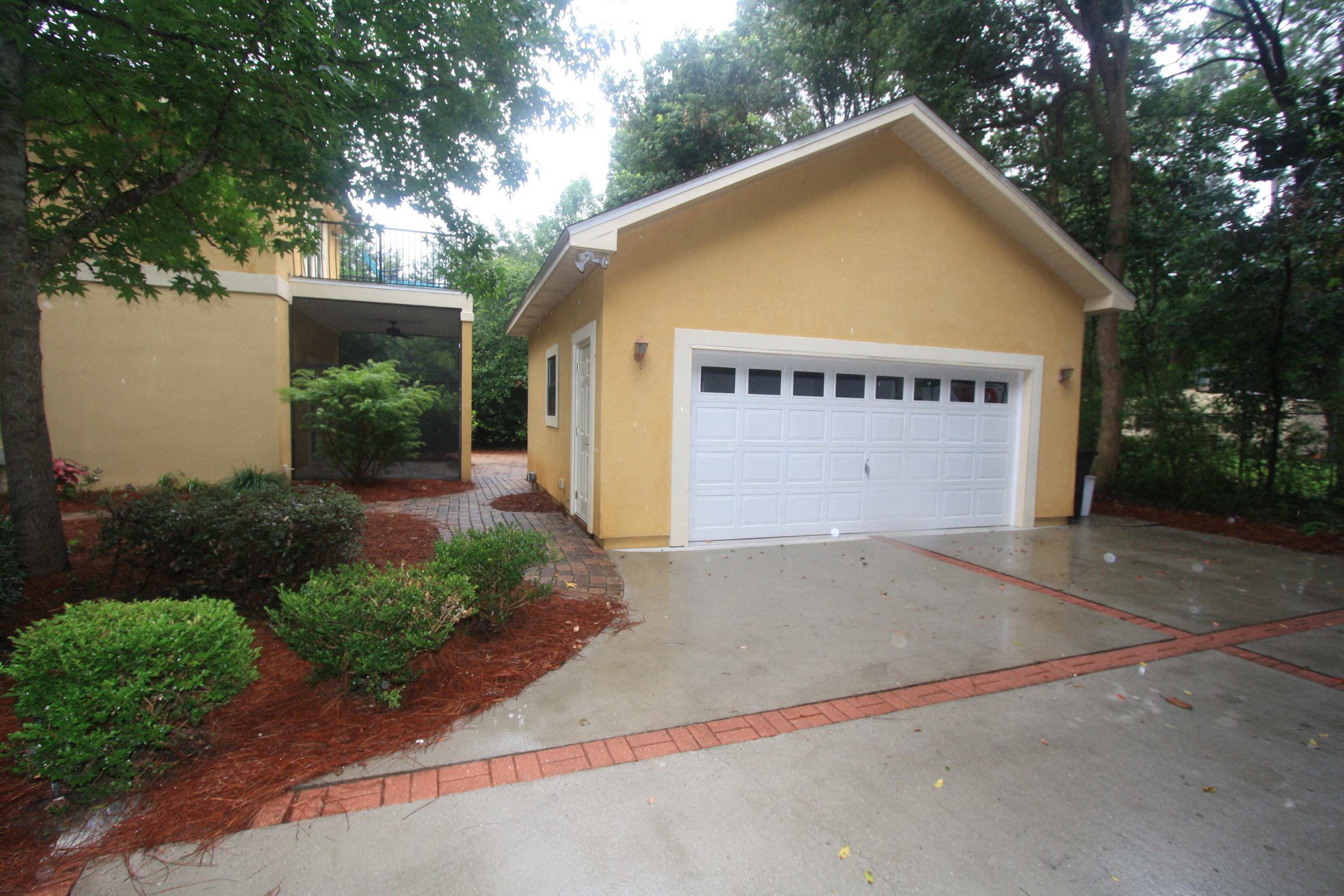129 Walton Way Miramar Beach, FL 32550 - Photo 27 of 29 a view of a house with a yard and garage