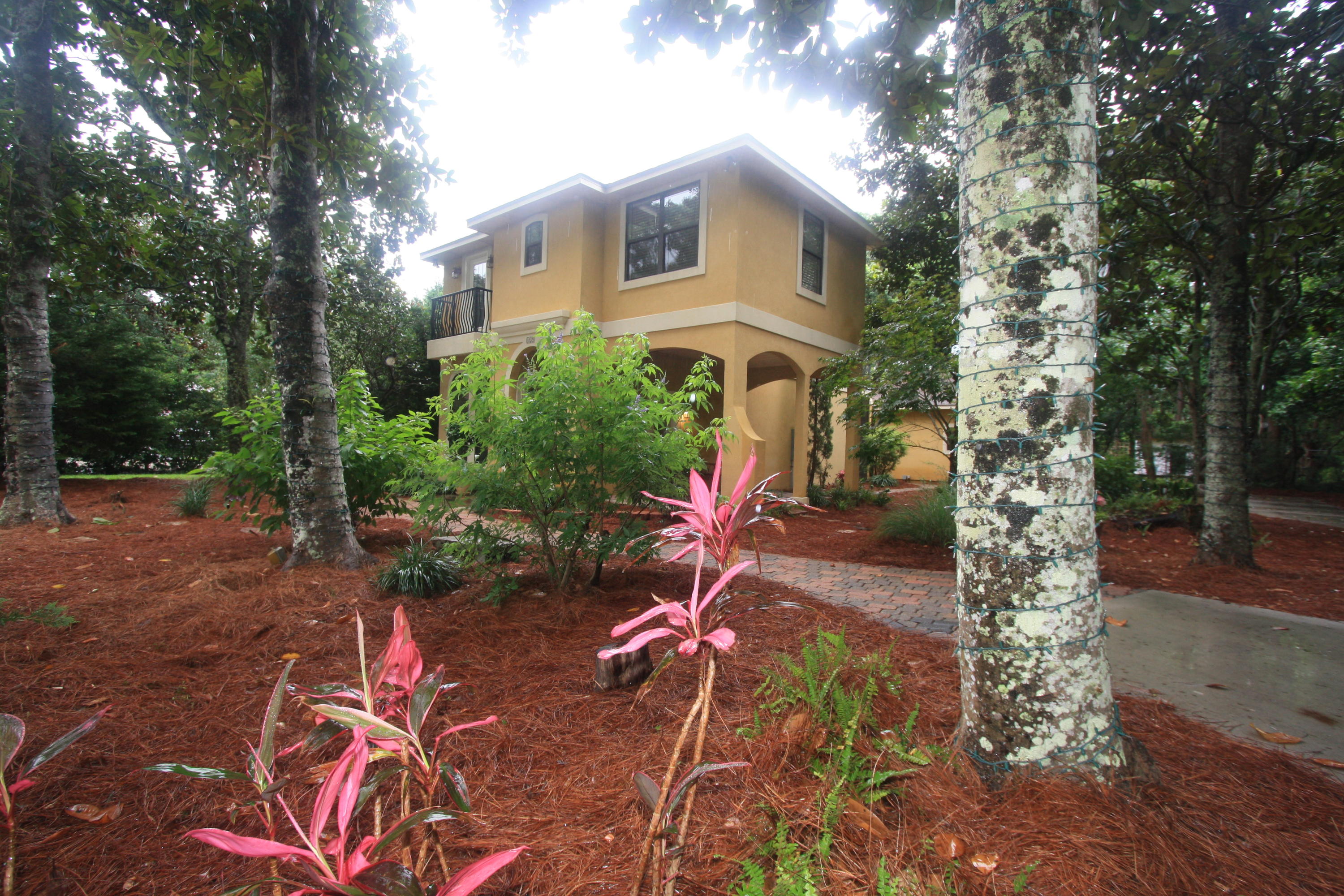 129 Walton Way Miramar Beach, FL 32550 - Photo 28 of 29 a front view of a house with garden