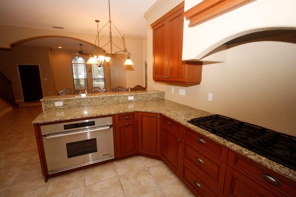 129 Walton Way Miramar Beach, FL 32550 - Photo 4 of 29 a kitchen with a sink and a stove