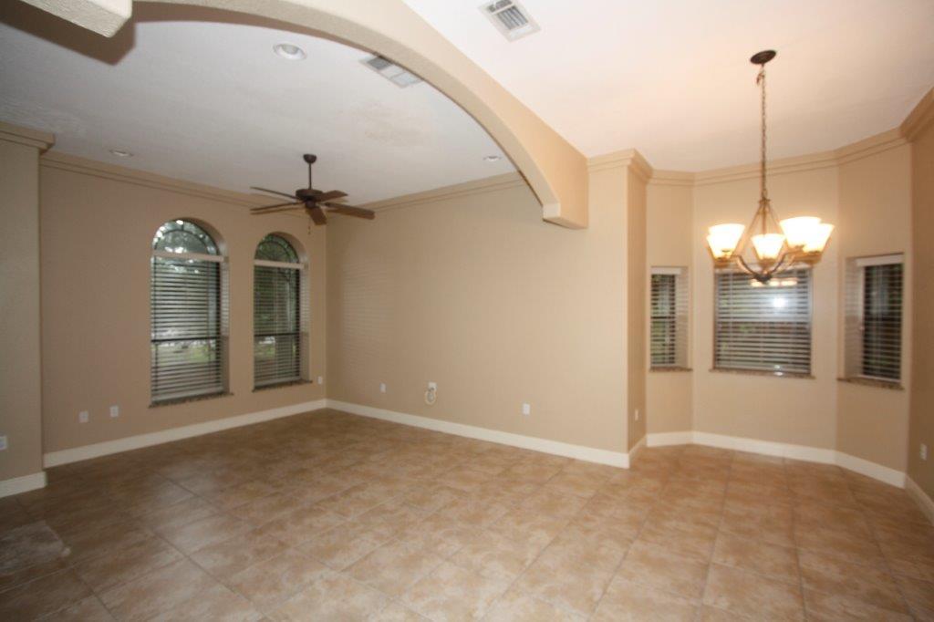 129 Walton Way Miramar Beach, FL 32550 - Photo 6 of 29 a view of a room with windows and ceiling fan