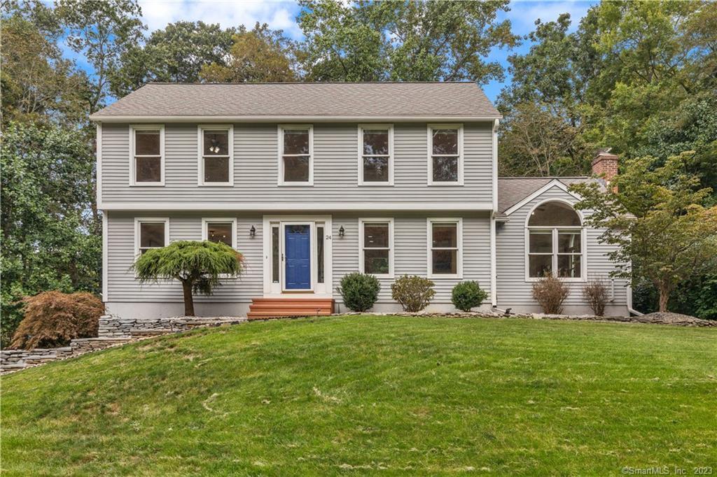 24 Lyle Drive Madison, CT 06443 - Photo 1 of 1 a front view of house with yard and green space