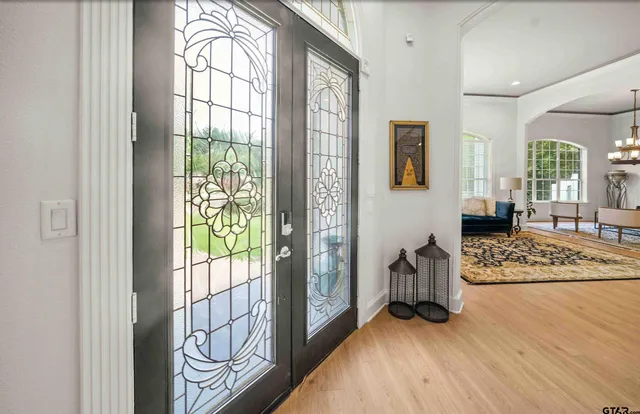 a view of an entryway with wooden floor