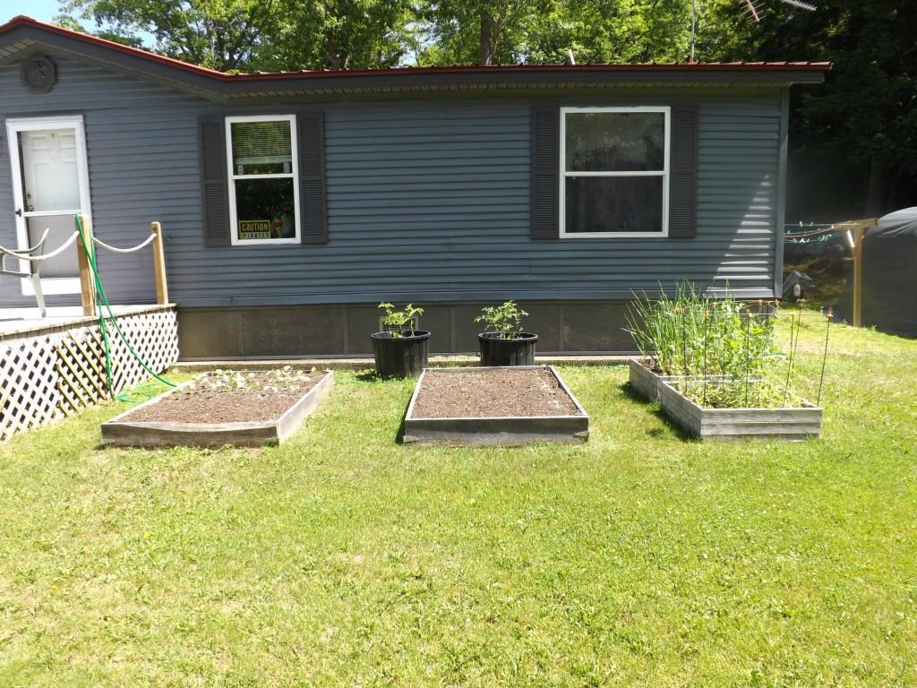 162 Higgins Hill Road Morrill, ME 04952 - Photo 8 of 23 Raised bed gardens.