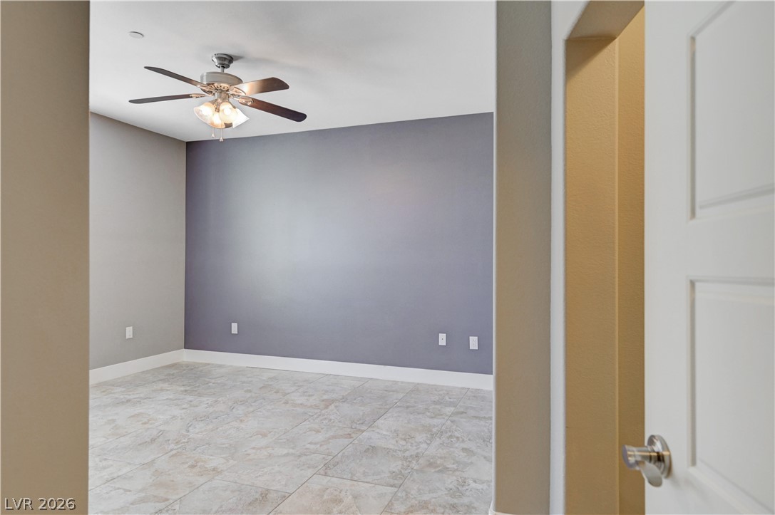 2555 Hampton Road, Unit 6108 Henderson, NV 89052 - Photo 20 of 63 Unfurnished room featuring a ceiling fan and baseboards