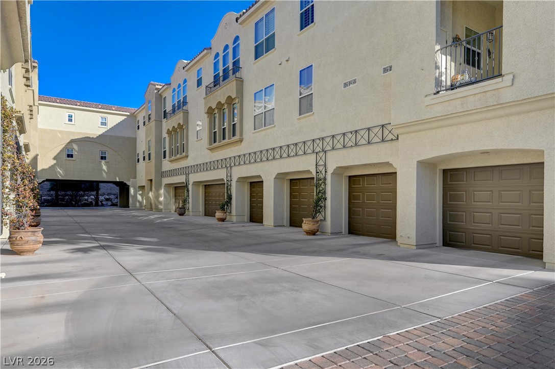2555 Hampton Road, Unit 6108 Henderson, NV 89052 - Photo 36 of 63 View of apartment building / complex with an attached garage and driveway